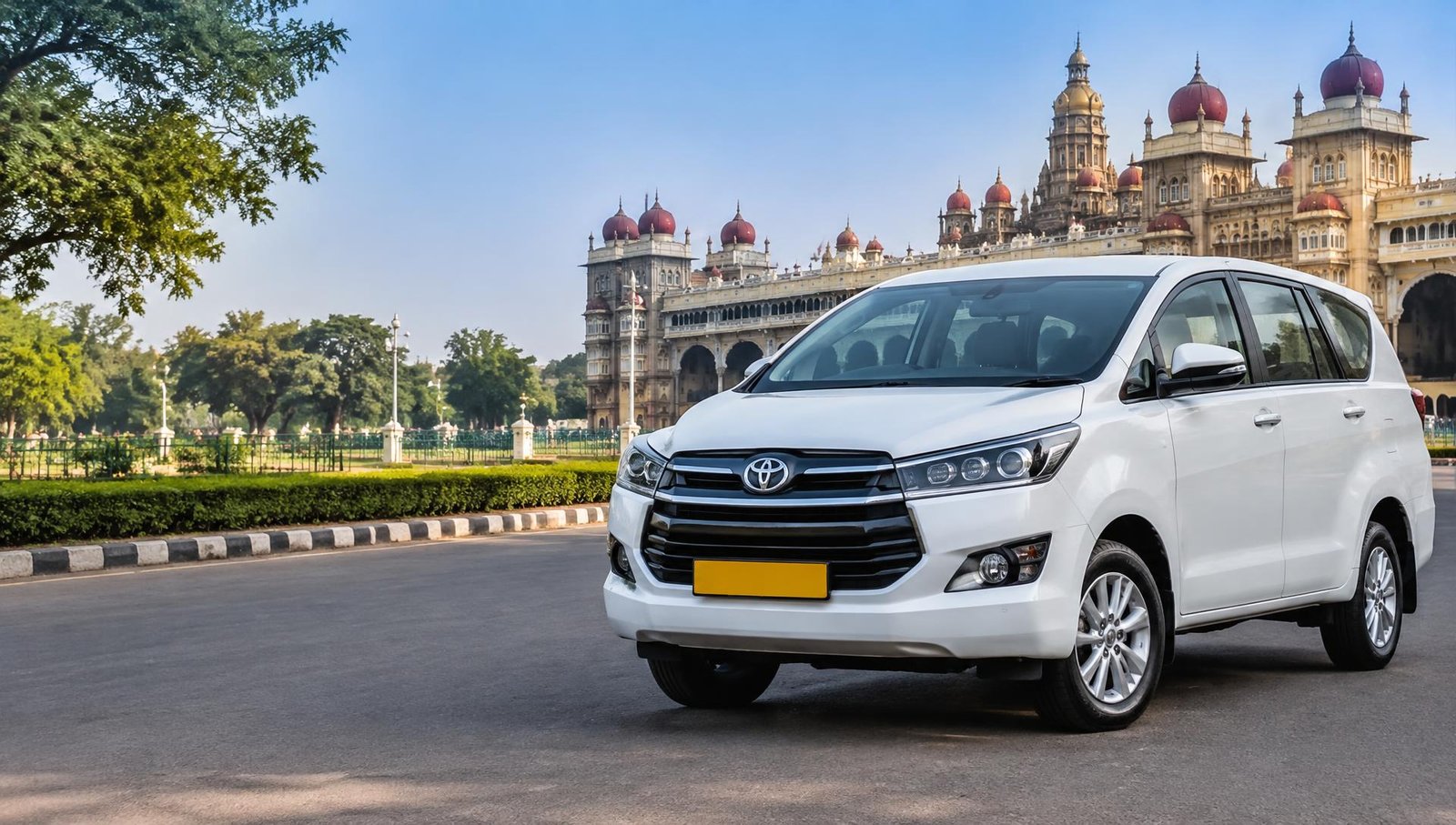 White Innova taxi near Mysore Palace